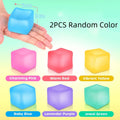Gel-filled squishy stress cube fidget toy for sensory calming, held in hand